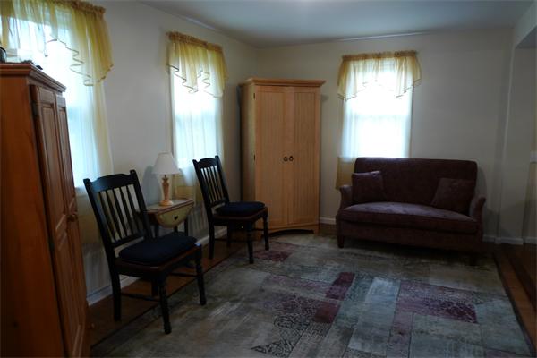 323 Appleton Street Arlington, MA 02476 - Photo 5 of 9 a living room with furniture and a window