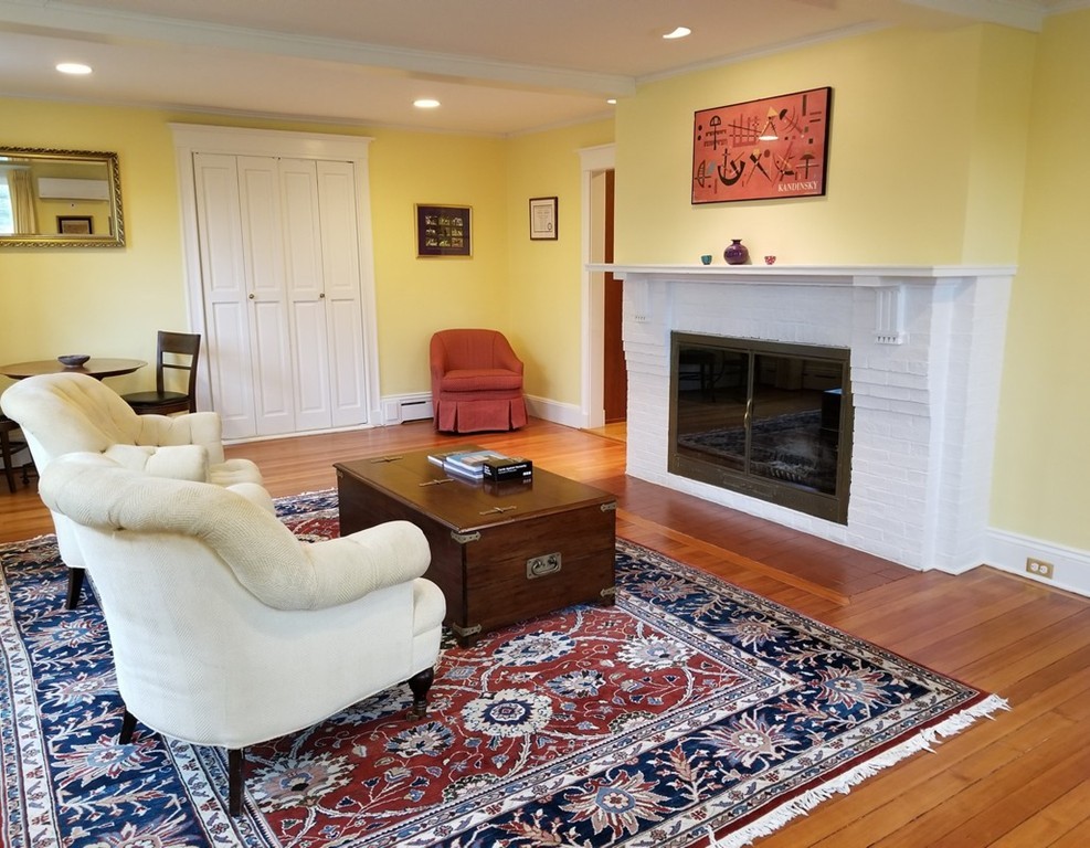 6 Hastings Road Lexington, MA 02421 - Photo 3 of 30 a living room with furniture and a fireplace