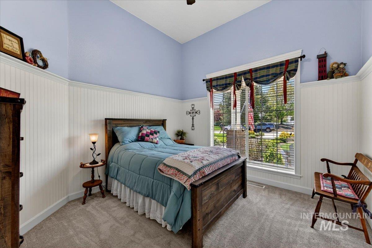 414 East Shafer View Drive Meridian, ID 83642 - Photo 25 of 50 Second Master en-suite has extensive decorative painted beadboard wall treatment, sunny window, plush carpeting, walk-in closet, attached full bathroom w/walk-in closet