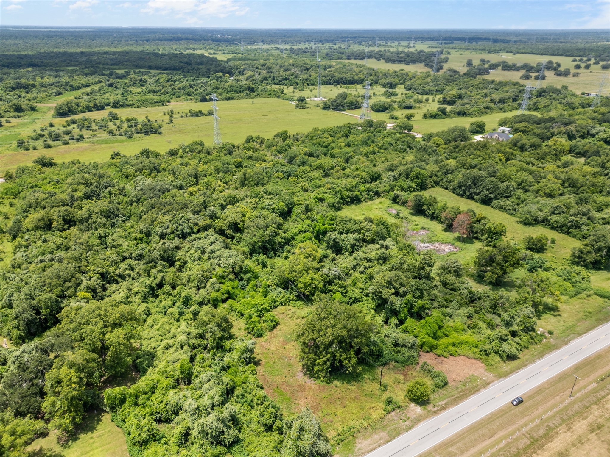 0 Fm-524 Tr Sweeny, TX 77480 - Photo 3 of 5 a view of a green field with an ocean view