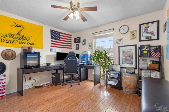 a work room with furniture and wooden floor