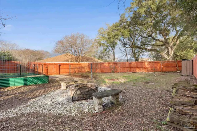 a view of backyard with outdoor space