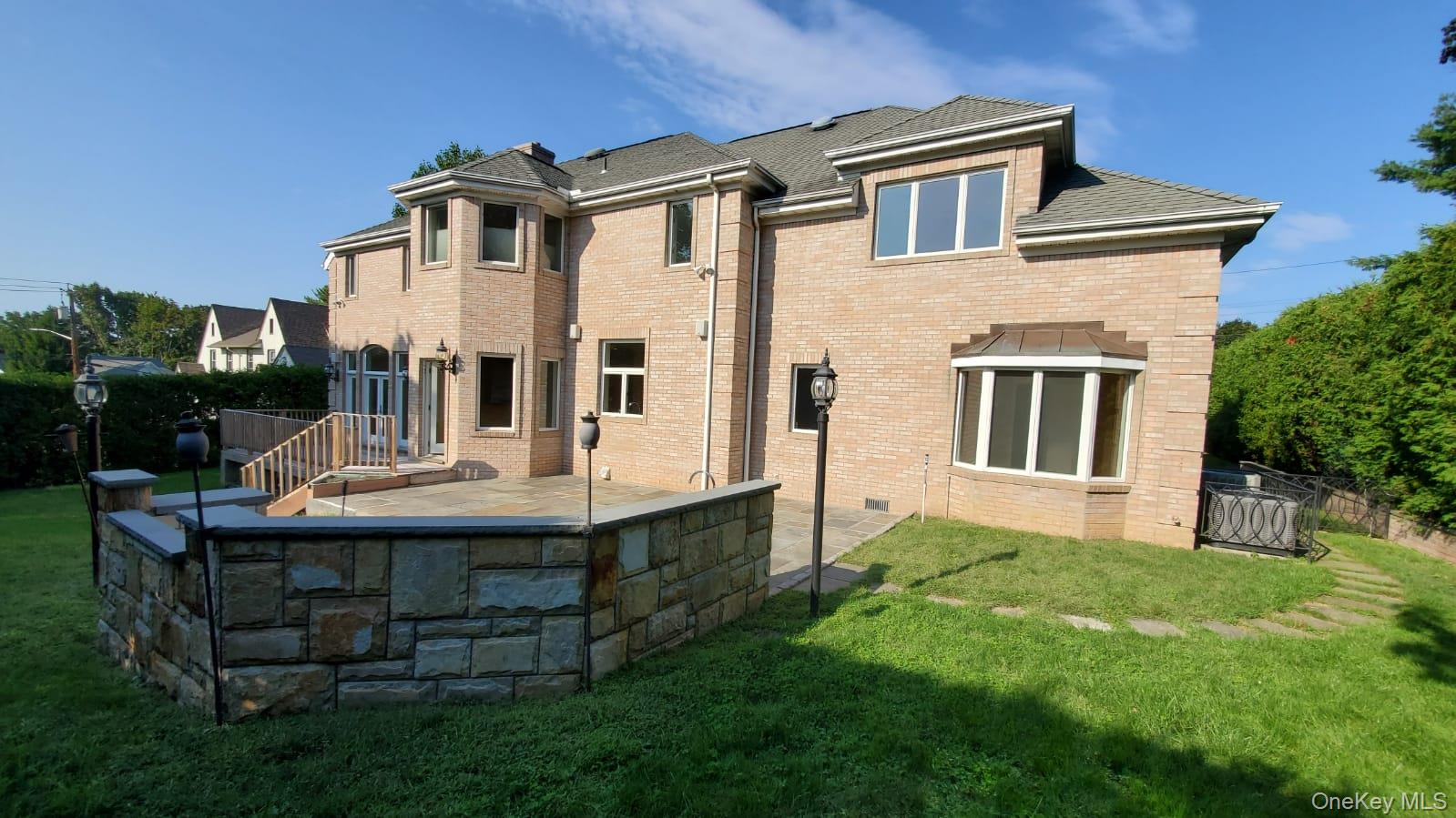14 Potters Lane New Rochelle, NY 10805 - Photo 13 of 14 a view of house with a yard and deck