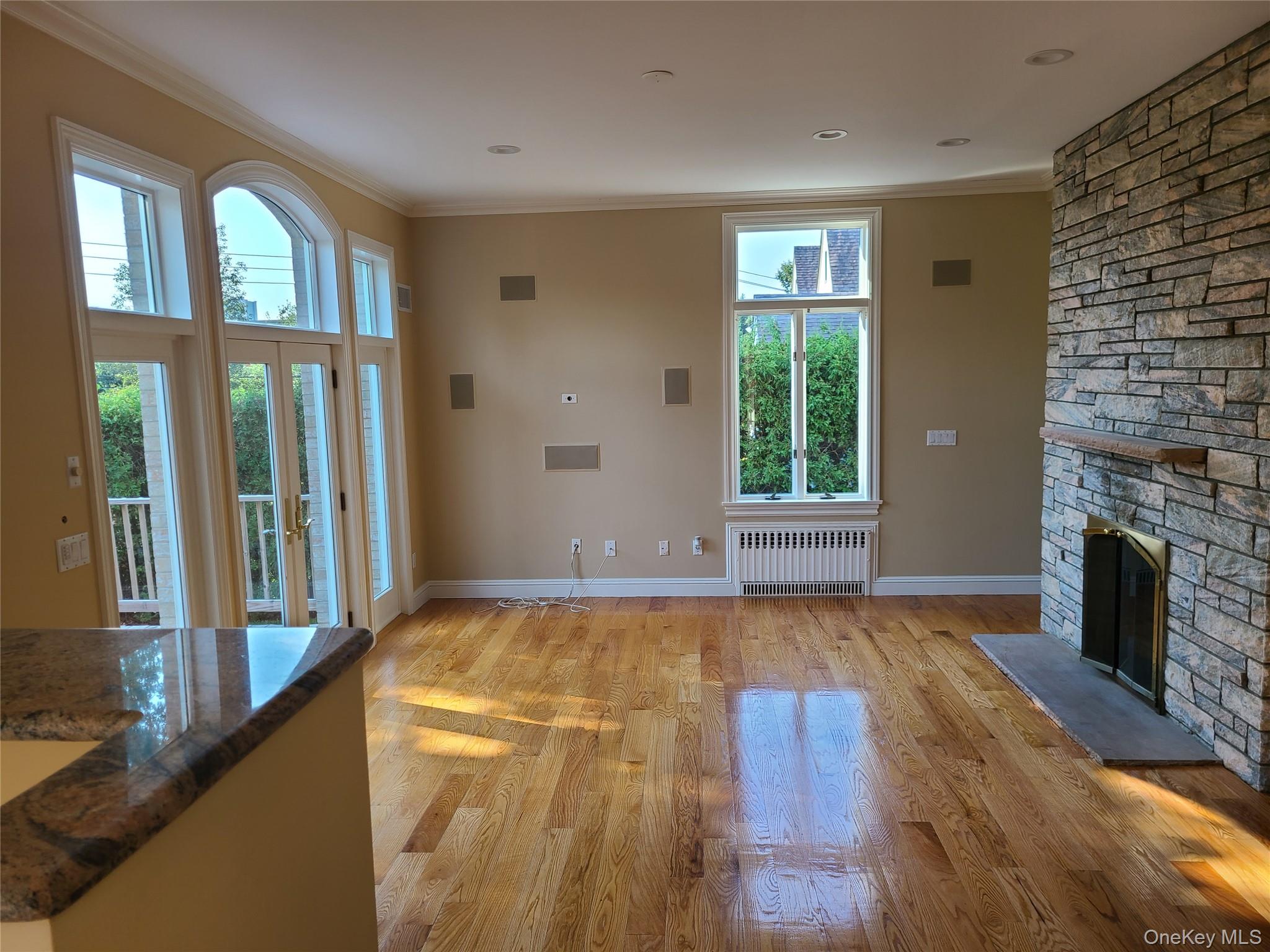 14 Potters Lane New Rochelle, NY 10805 - Photo 6 of 14 a view of a livingroom with wooden floor and a fireplace