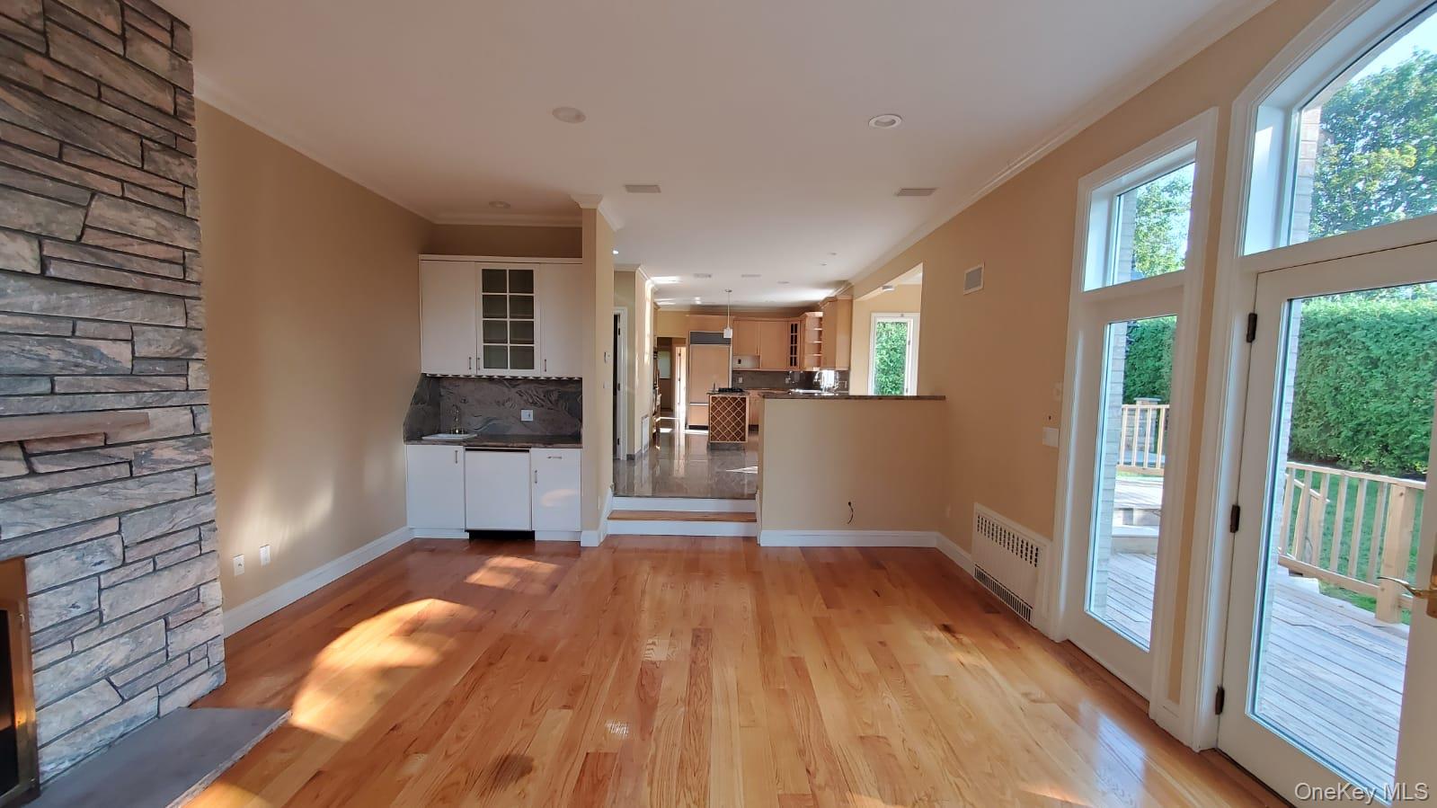 14 Potters Lane New Rochelle, NY 10805 - Photo 7 of 14 a view of a living room hardwood floor and a kitchen