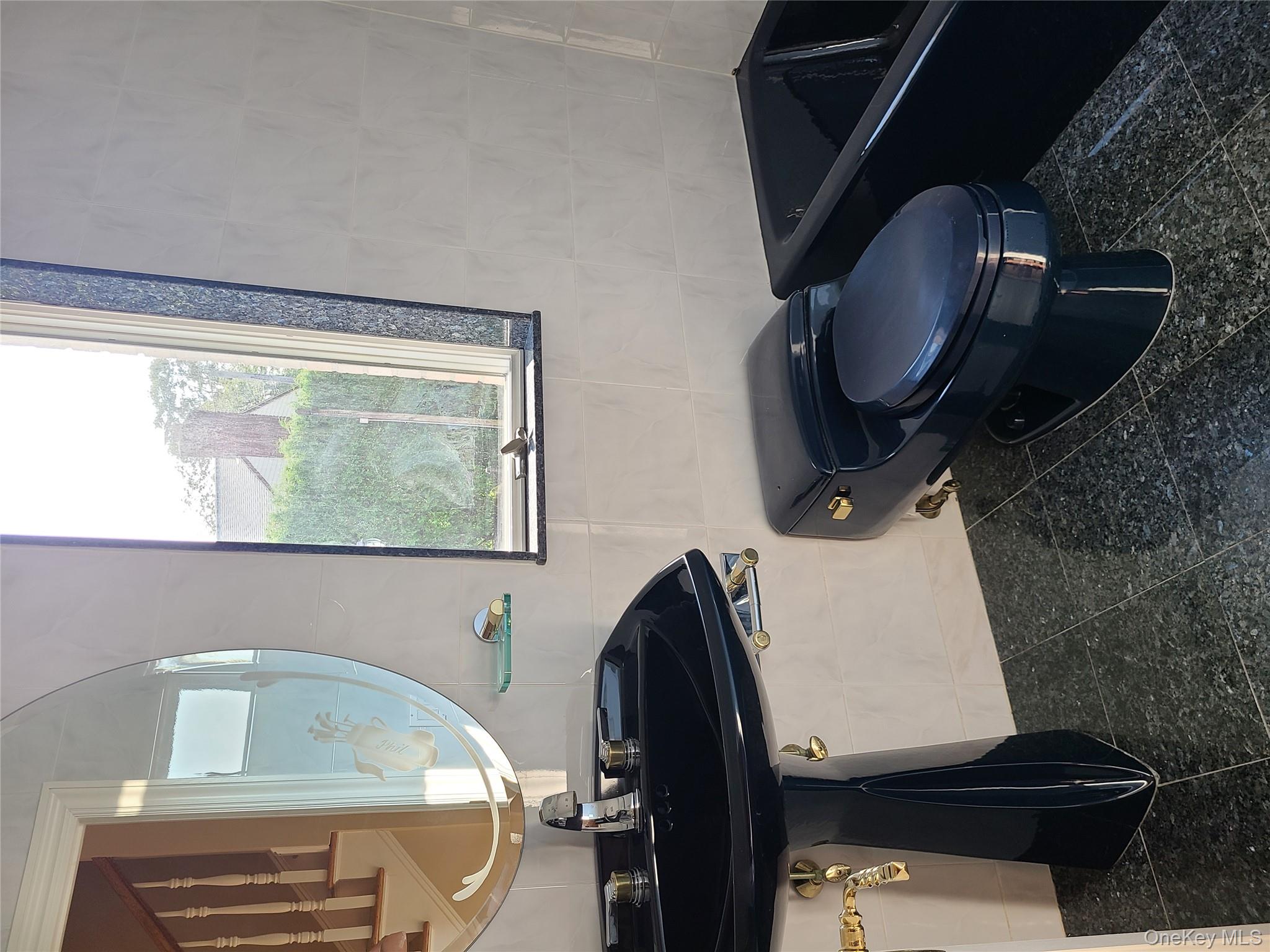 14 Potters Lane New Rochelle, NY 10805 - Photo 9 of 14 a bathroom with a sink a toilet and a mirror