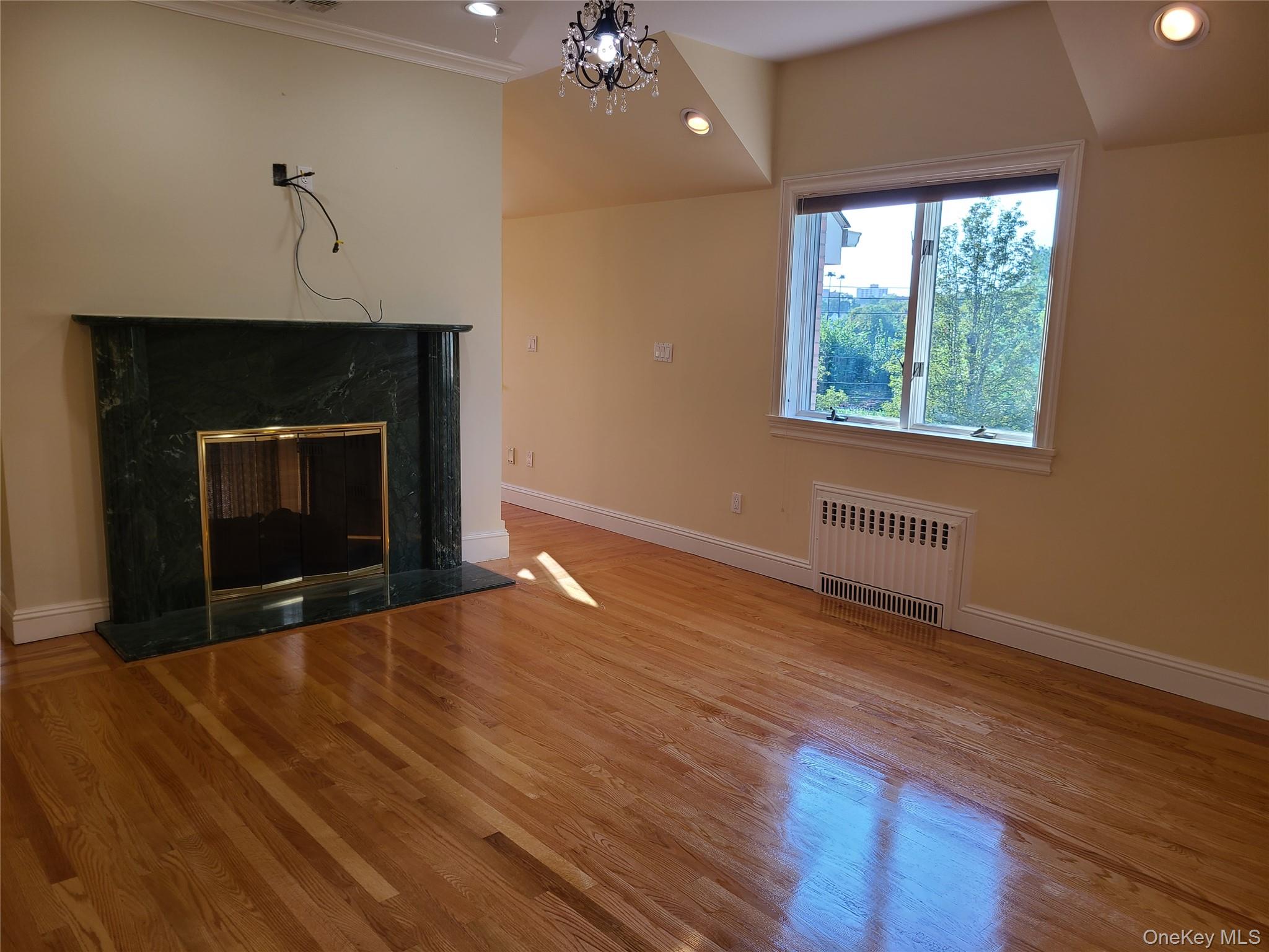 14 Potters Lane New Rochelle, NY 10805 - Photo 10 of 14 a view of an empty room with wooden floor and a window