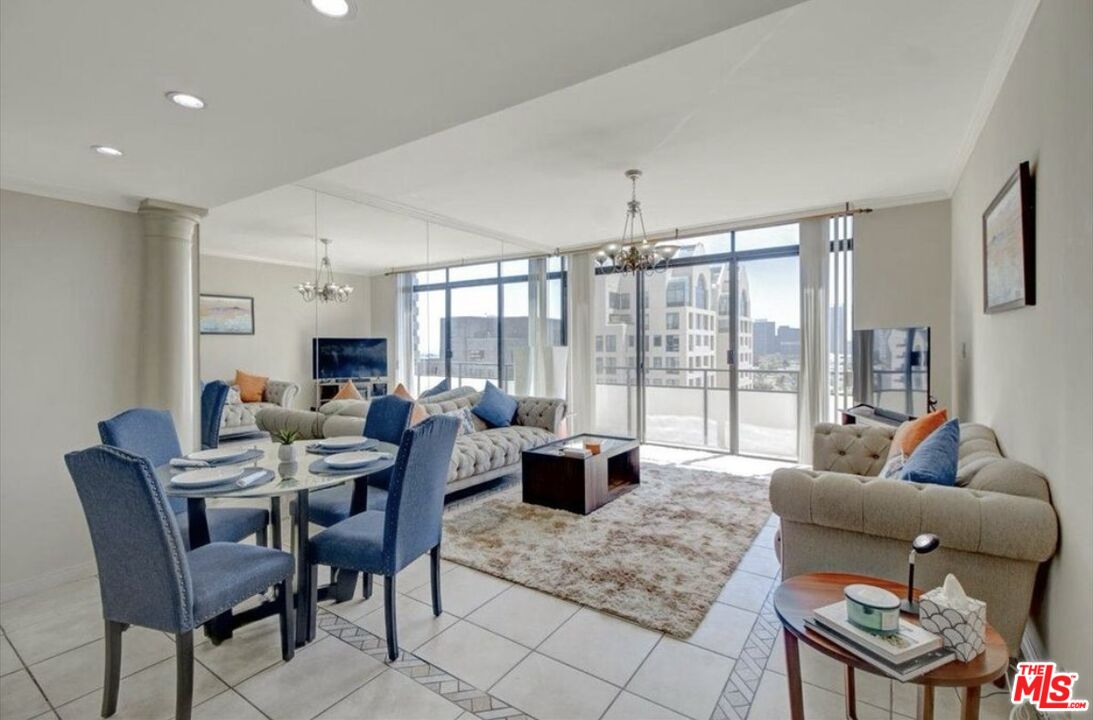 10535 Wilshire Boulevard, Unit 1701 Los Angeles, CA 90024 - Photo 4 of 18 a living room with furniture and a large window