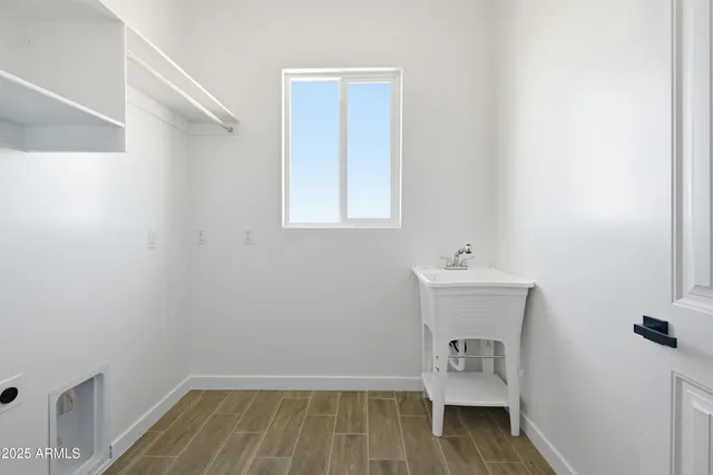 a room with a sink and a mirror
