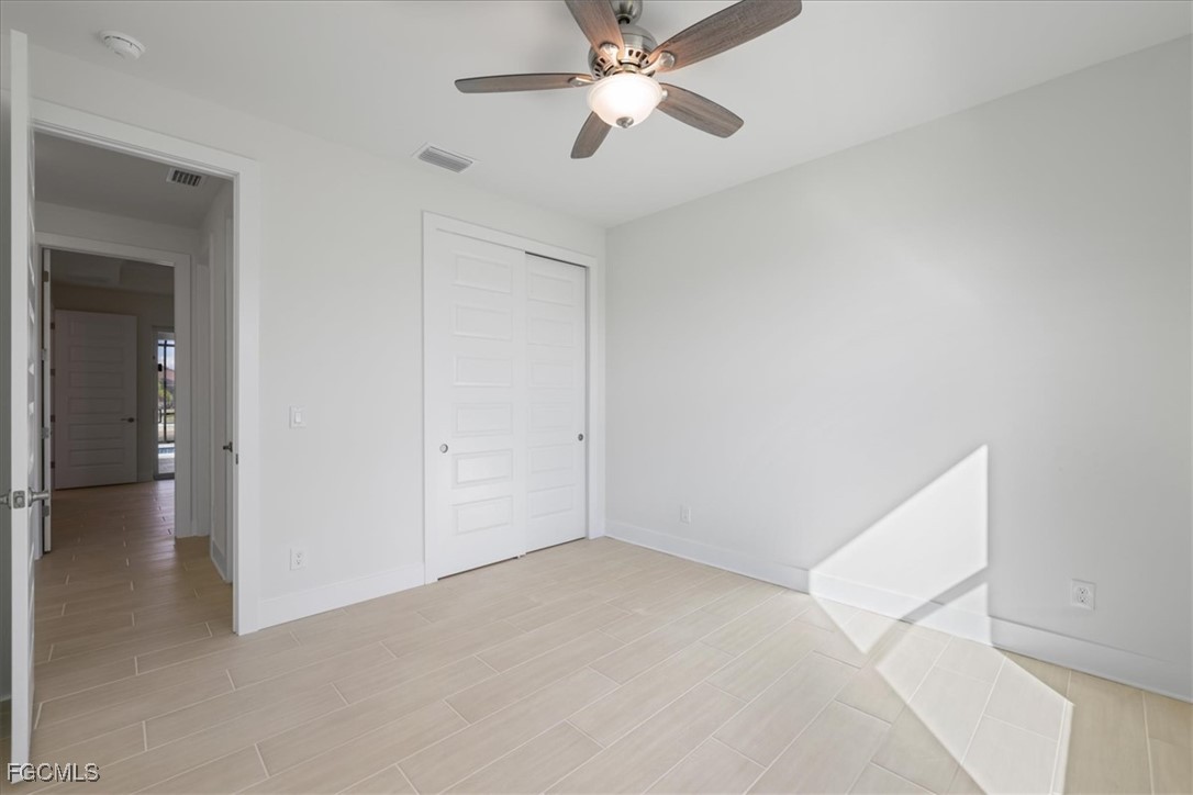 433 Southwest 21st Street Cape Coral, FL 33991 - Photo 20 of 50 a view of an empty room and chandelier fan