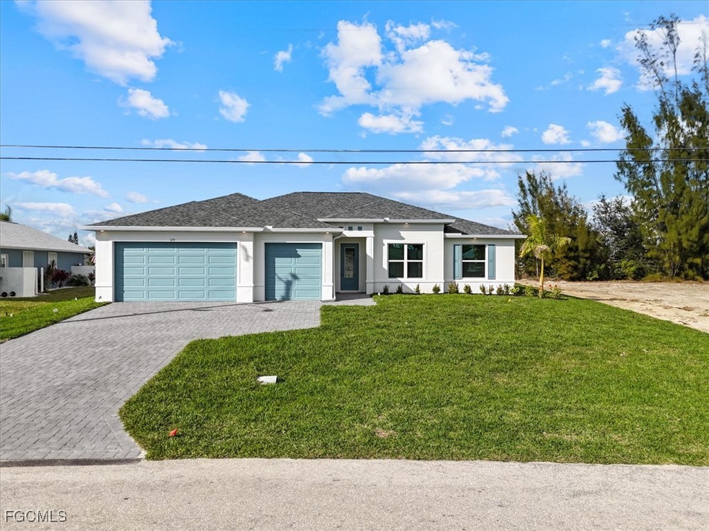433 Southwest 21st Street Cape Coral, FL 33991 - Photo 2 of 50 a backyard of a house with lots of green space