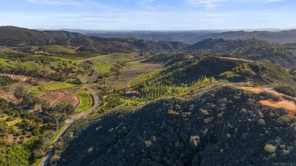 a view of a city with mountains in the background