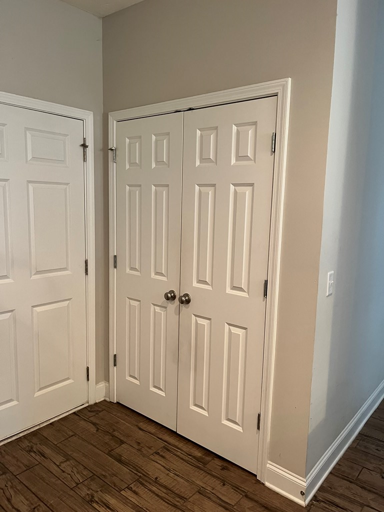 6067 Townes Way Columbus, GA 31909 - Photo 12 of 35 a view of a closet area with wooden floor