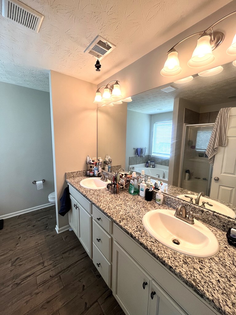 6067 Townes Way Columbus, GA 31909 - Photo 21 of 35 a bathroom with a double vanity sink and a mirror
