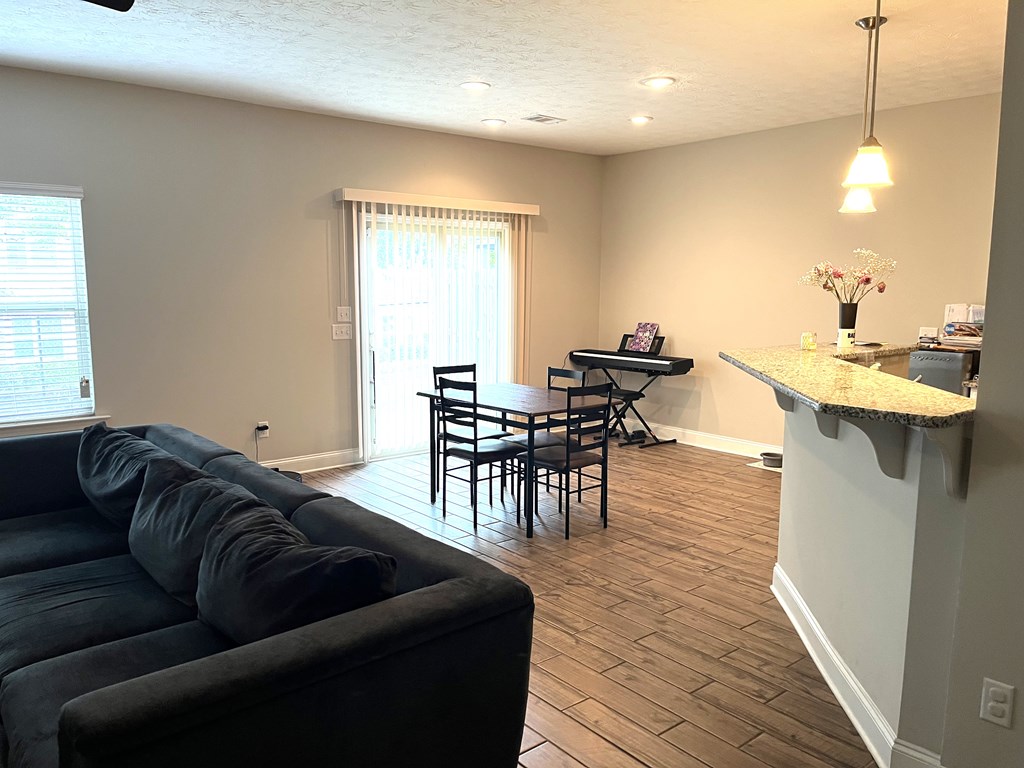 6067 Townes Way Columbus, GA 31909 - Photo 6 of 35 a living room with furniture and a wooden floor