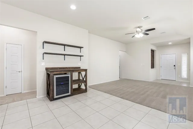 a view of empty room with fireplace