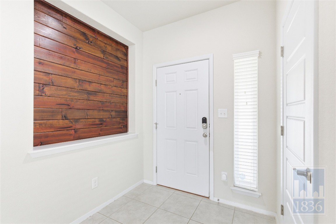 7615 Europa Avenue, Unit 139 Round Rock, TX 78665 - Photo 2 of 40 a view of front door with wooden floor