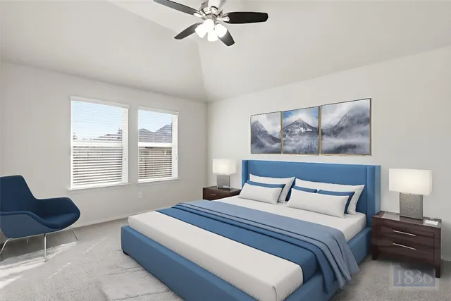 a bedroom with a large bed and a window