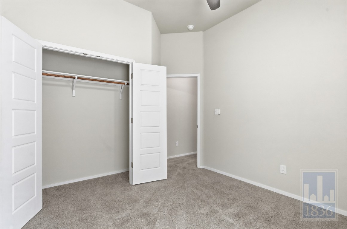 7615 Europa Avenue, Unit 139 Round Rock, TX 78665 - Photo 27 of 40 an empty room with closet and mirror