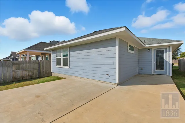 a view of backyard of house