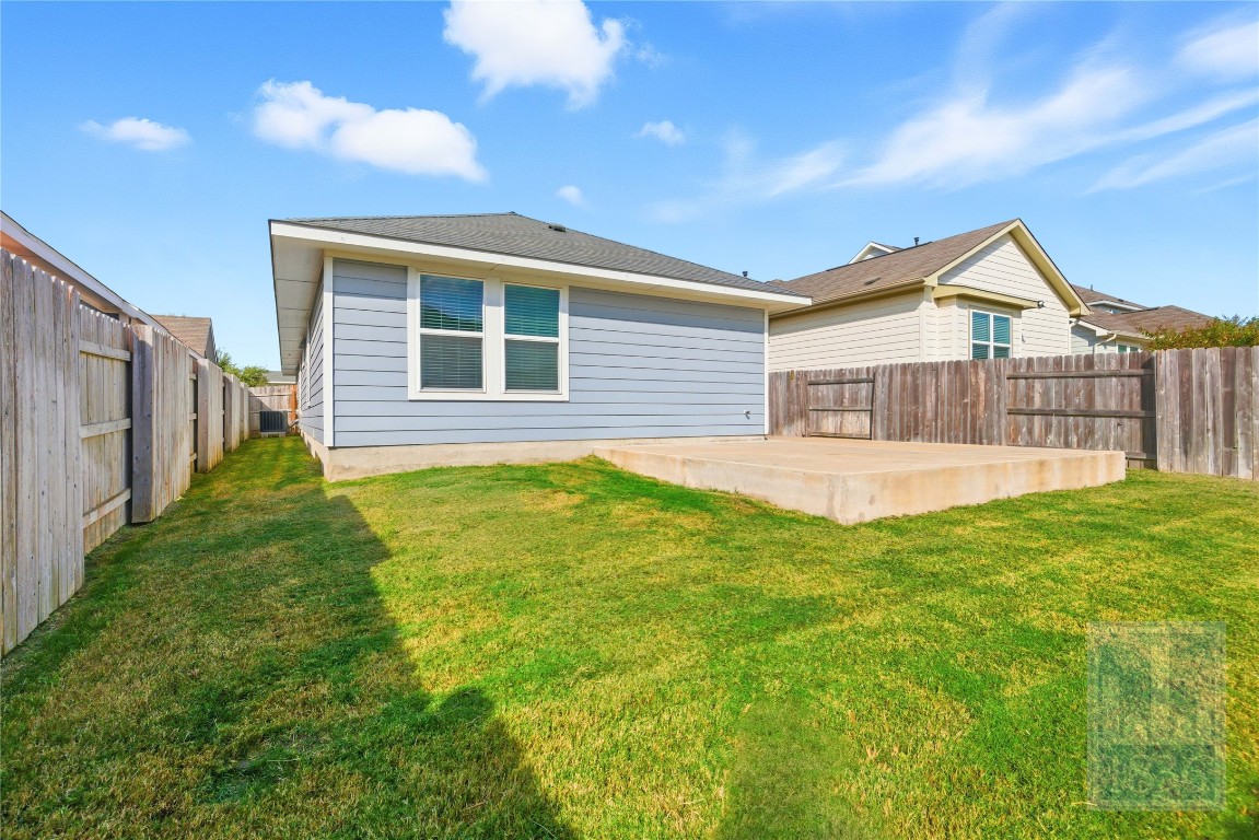 7615 Europa Avenue, Unit 139 Round Rock, TX 78665 - Photo 37 of 40 a view of a house with a backyard and porch