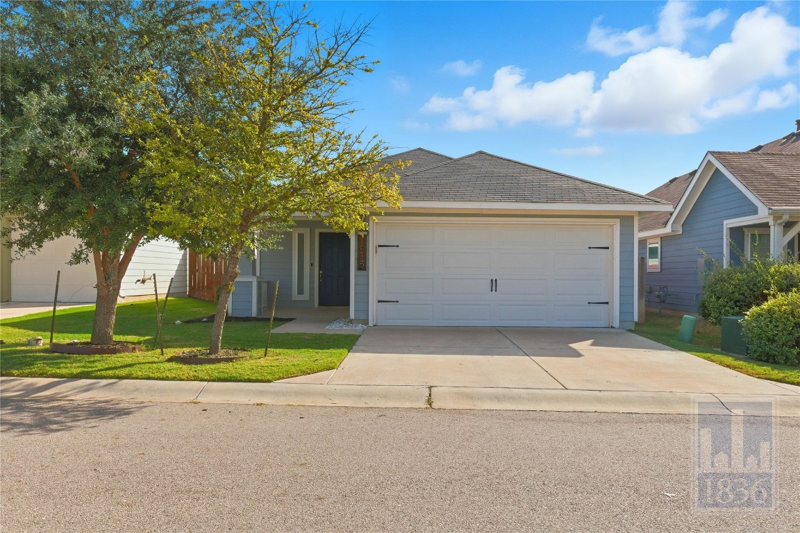 7615 Europa Avenue, Unit 139 Round Rock, TX 78665 - Photo 40 of 40 a front view of a house with a yard and garage