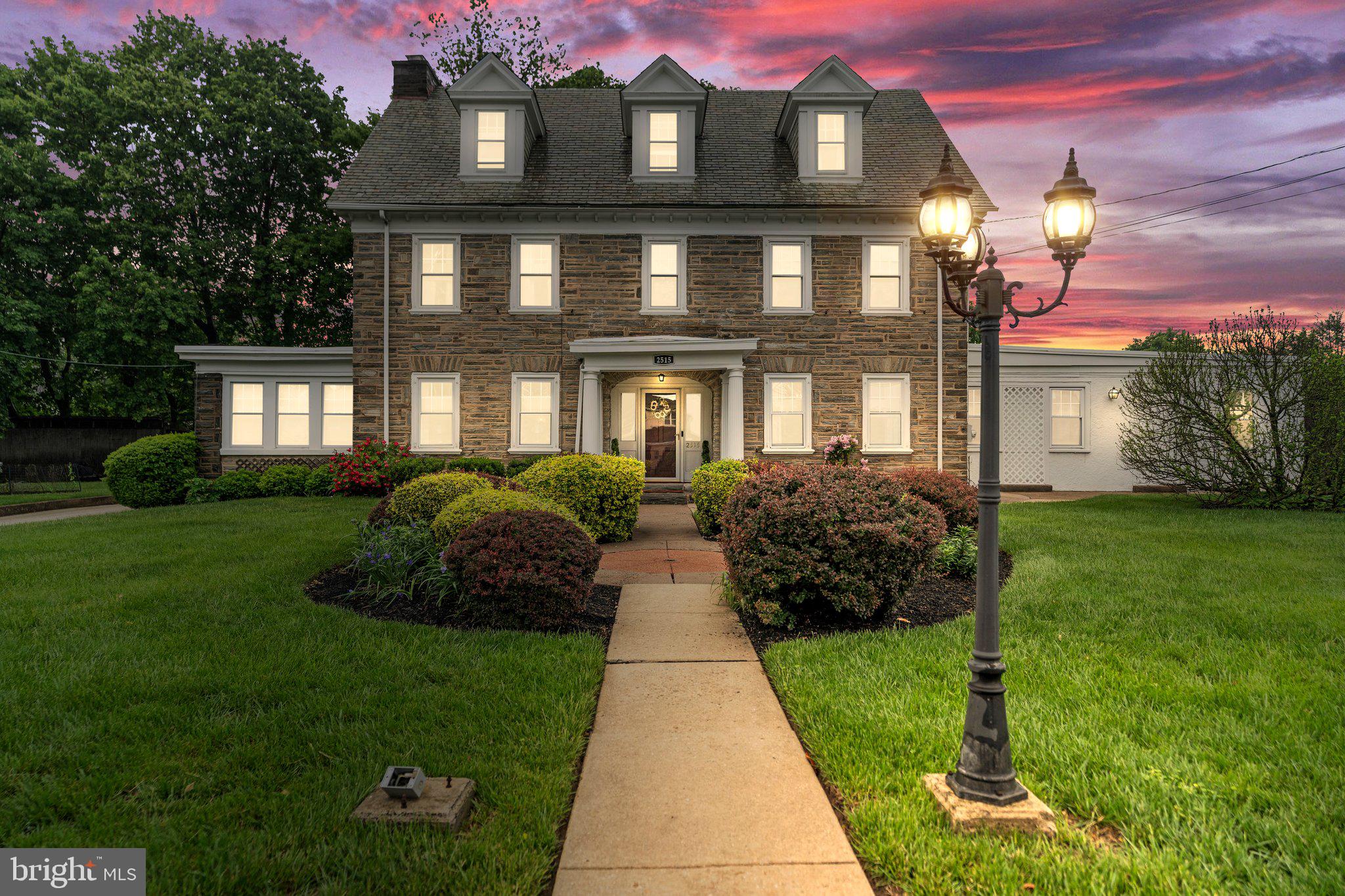 2515 Garrett Road Drexel Hill, PA 19026 - Photo 1 of 61 a front view of a house with a garden