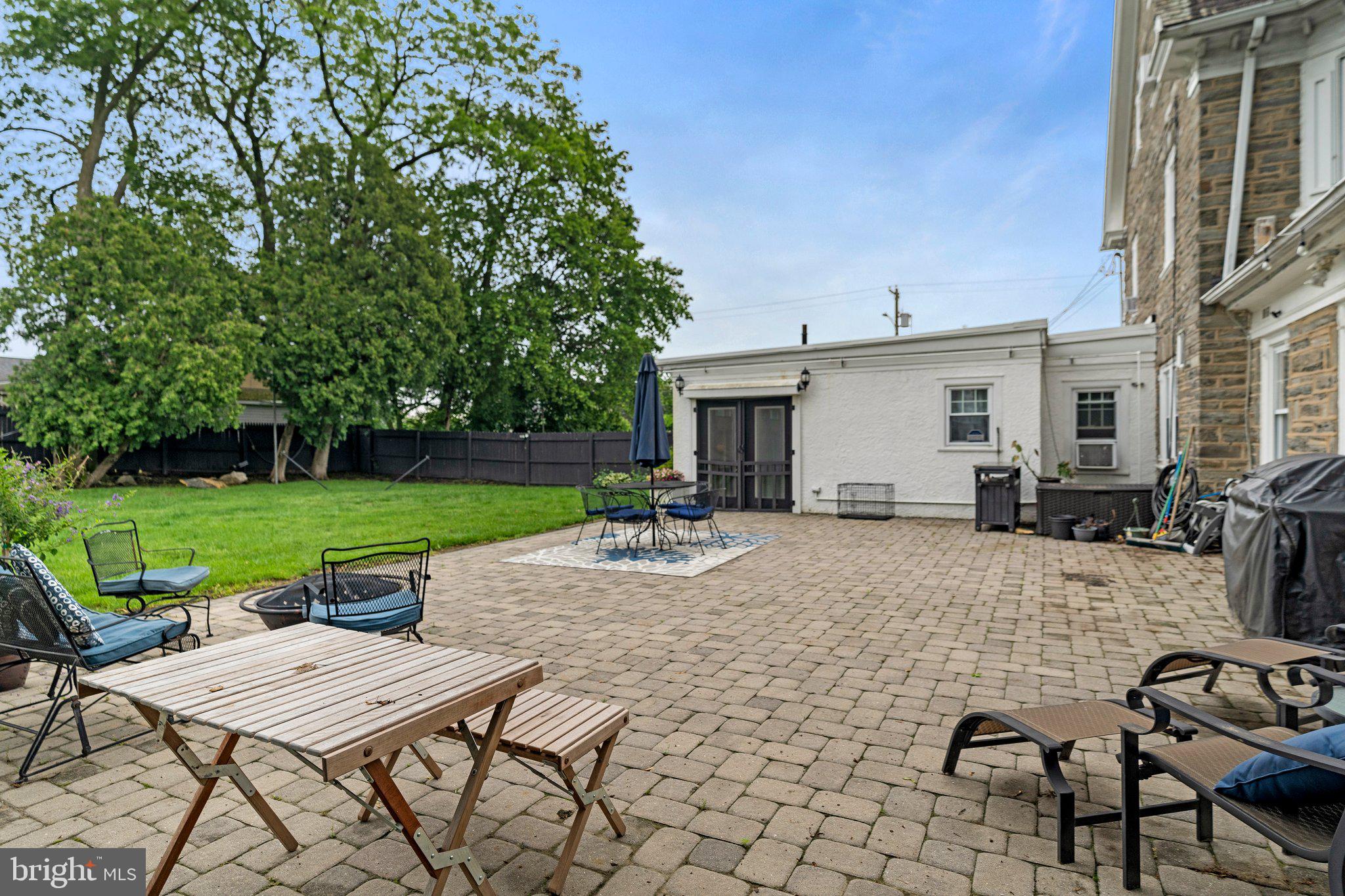 2515 Garrett Road Drexel Hill, PA 19026 - Photo 53 of 61 a view of a patio with a dining table and chairs with a patio