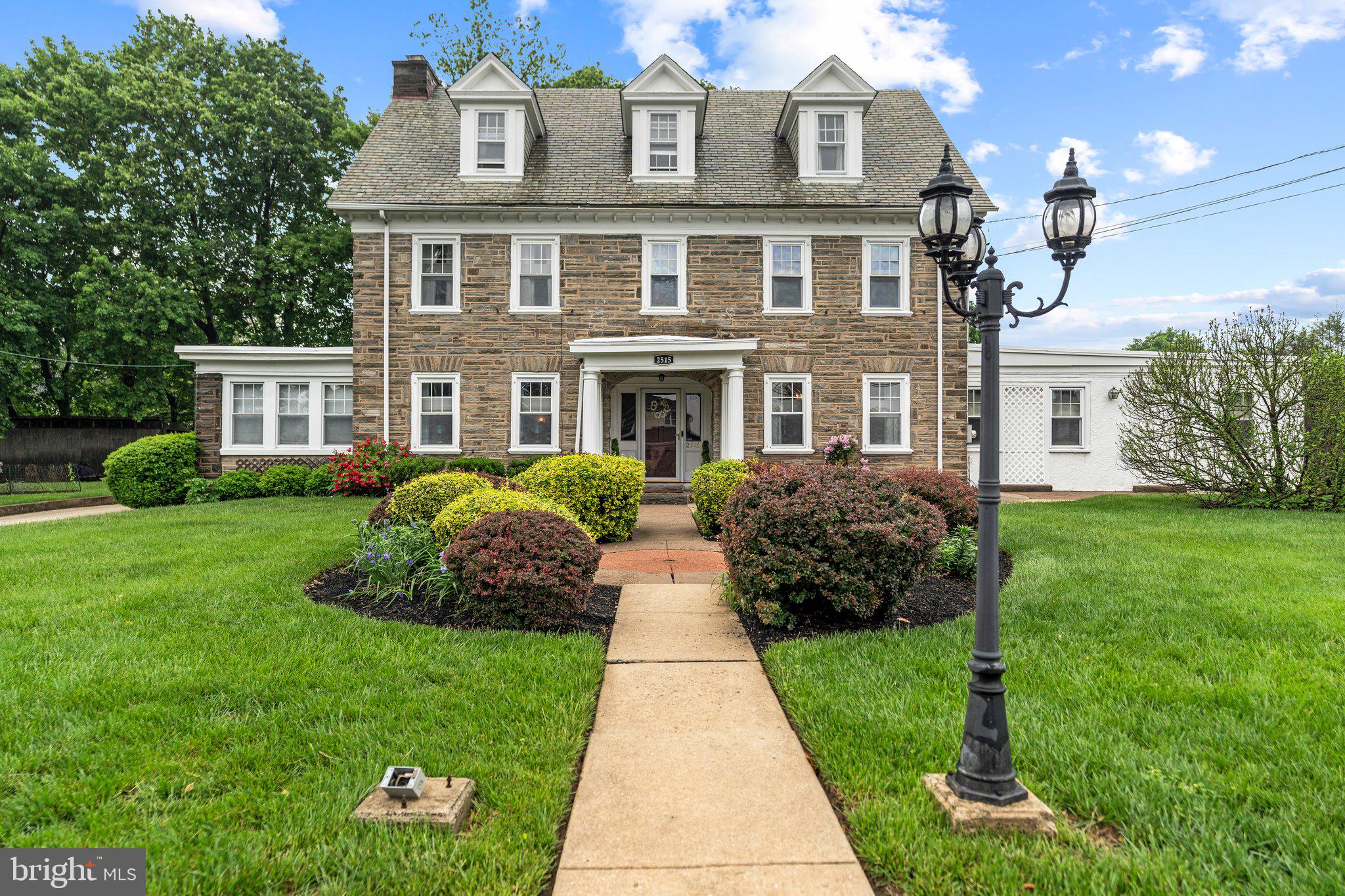 2515 Garrett Road Drexel Hill, PA 19026 - Photo 58 of 61 a front view of a house with a garden