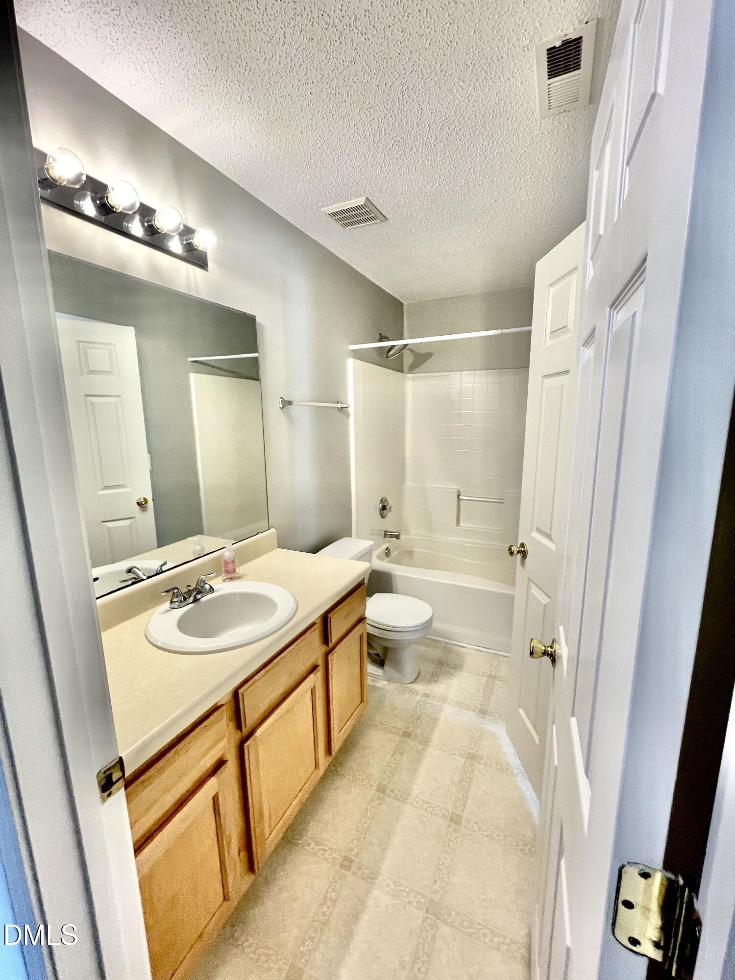 5428 Roan Mountain Place Raleigh, NC 27613 - Photo 10 of 22 This hallway bathroom also opens to the adjacent bedroom. Directly across from here is the pre-plumbed half bath, currently used as storage.