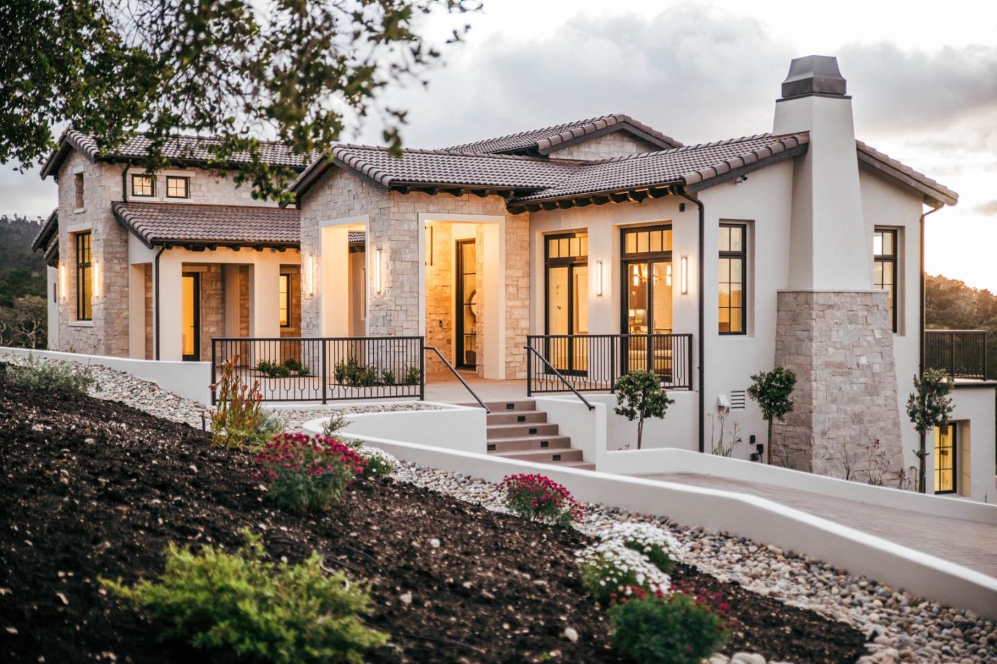 8210 Manjares Road Monterey, CA 93940 - Photo 1 of 76 a front view of a house with a large window and potted plants