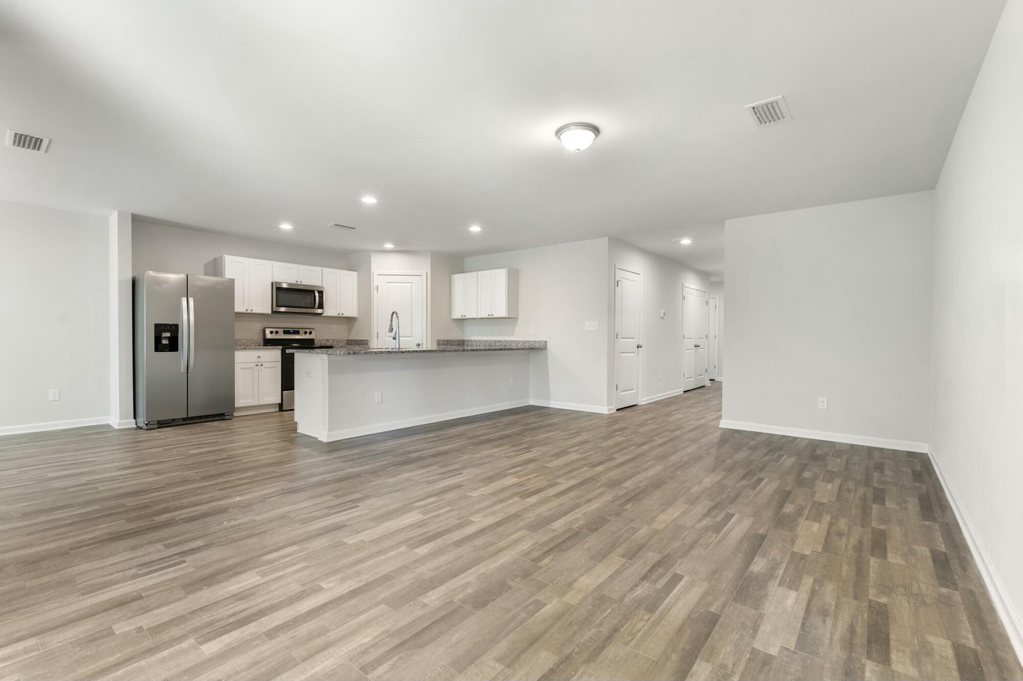 610 Riverwalk Circle Freeport, FL 32439 - Photo 11 of 50 a view of kitchen with wooden floor