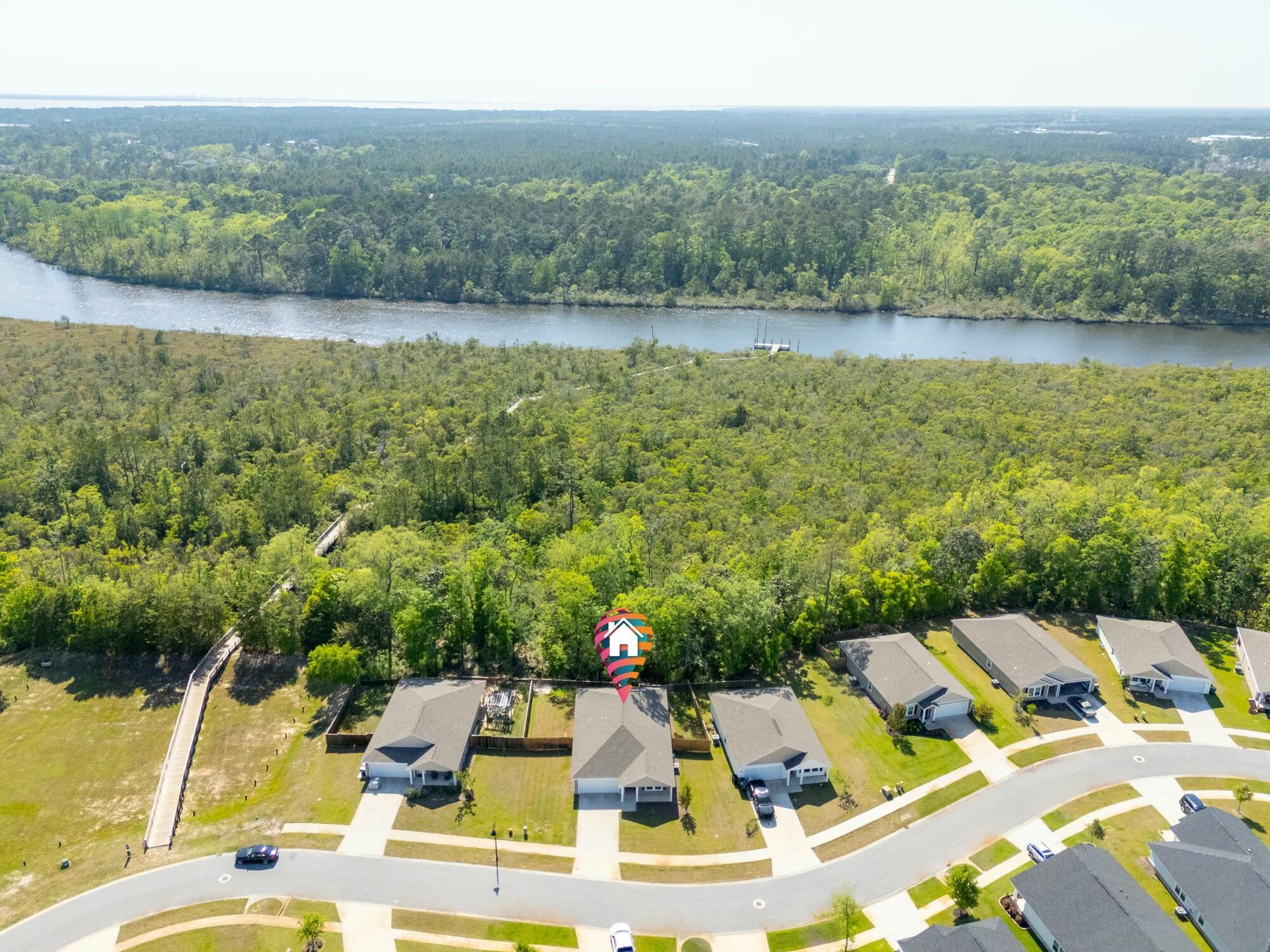 610 Riverwalk Circle Freeport, FL 32439 - Photo 2 of 50 a view of a lake with couches