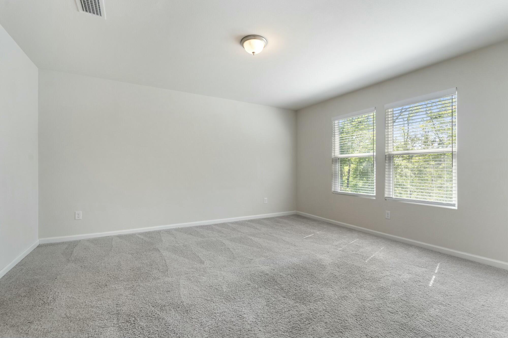 610 Riverwalk Circle Freeport, FL 32439 - Photo 21 of 50 an empty room with windows