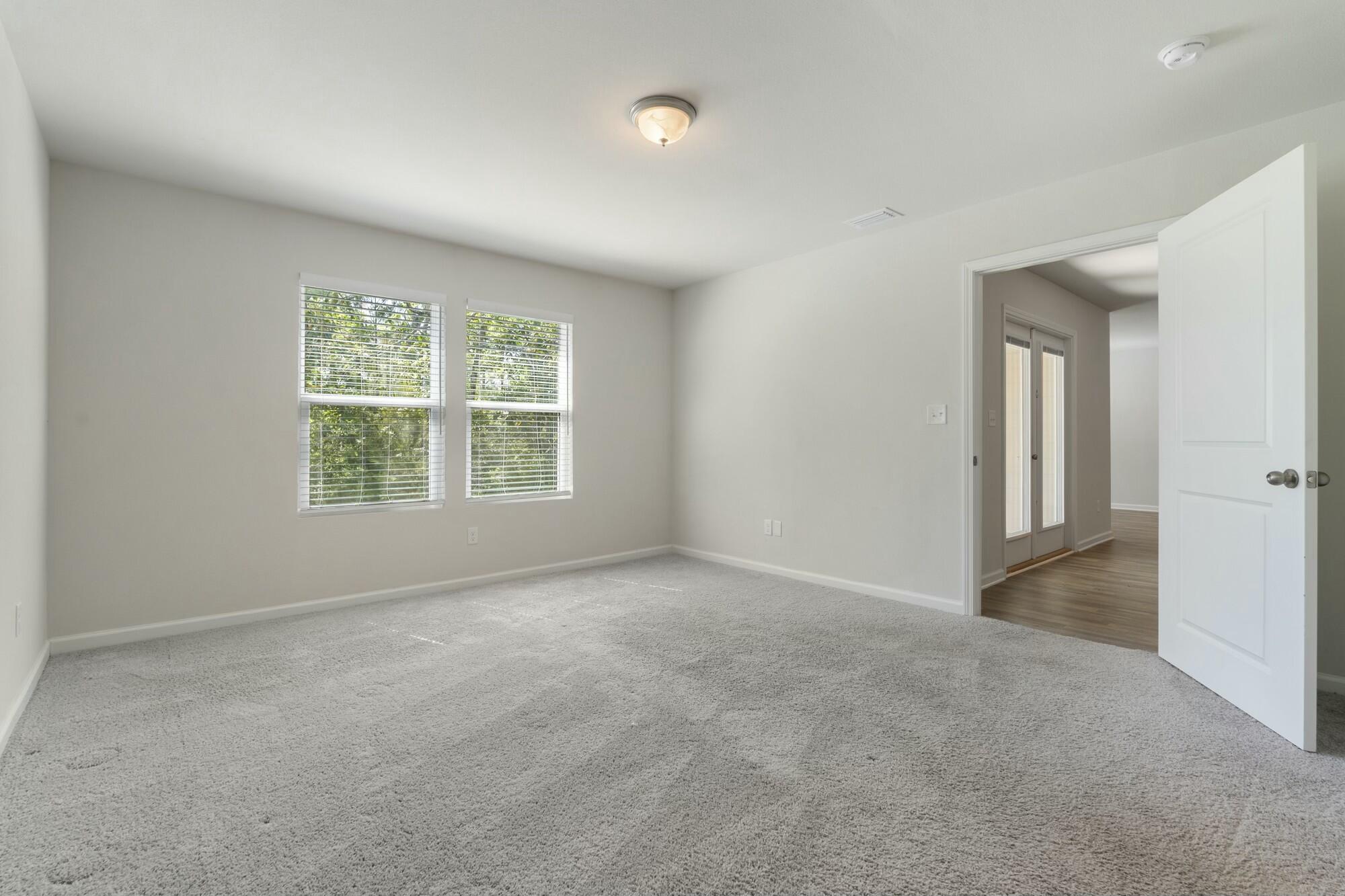 610 Riverwalk Circle Freeport, FL 32439 - Photo 22 of 50 an empty room with windows and closet