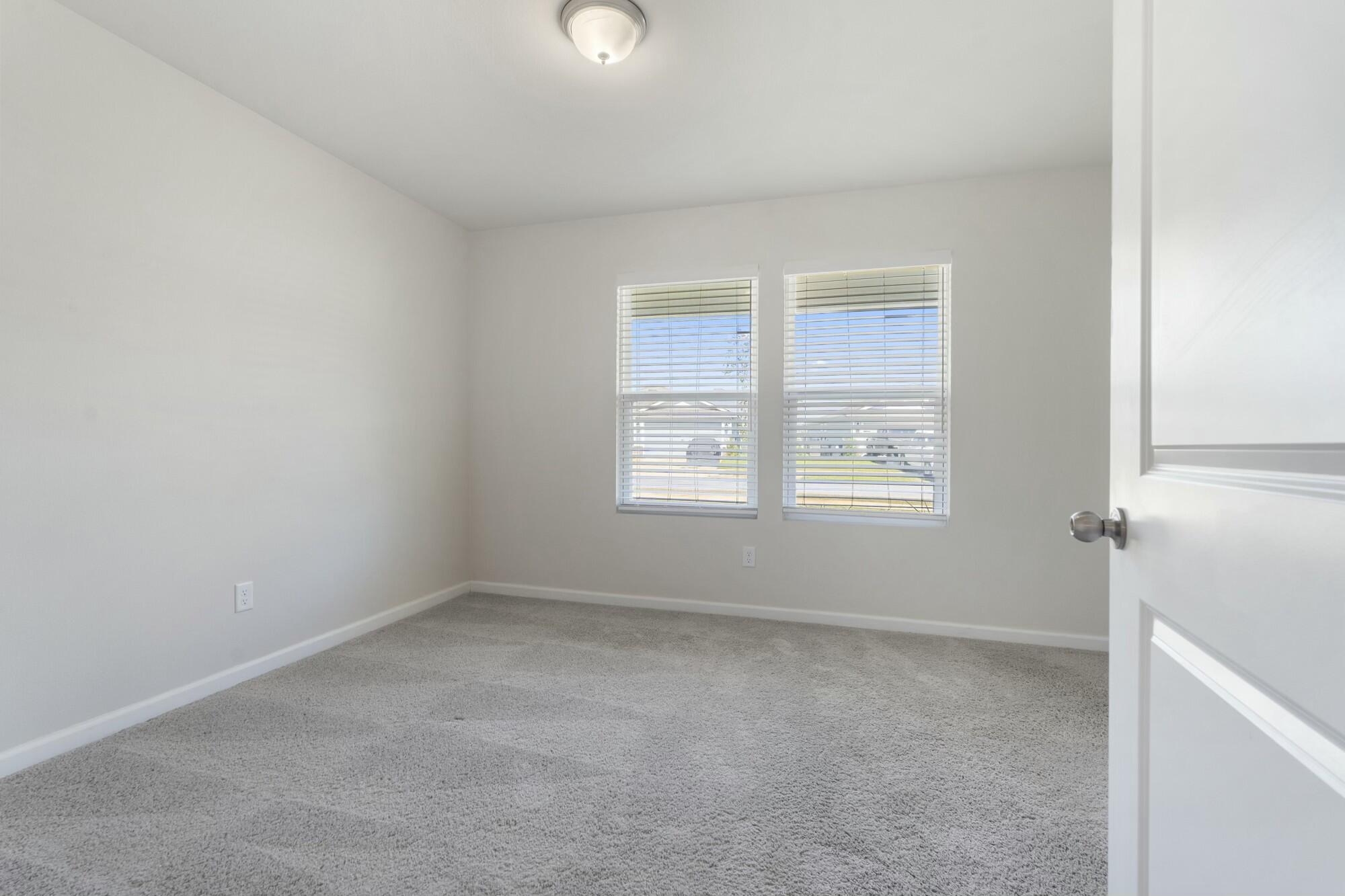 610 Riverwalk Circle Freeport, FL 32439 - Photo 28 of 50 an empty room with a window