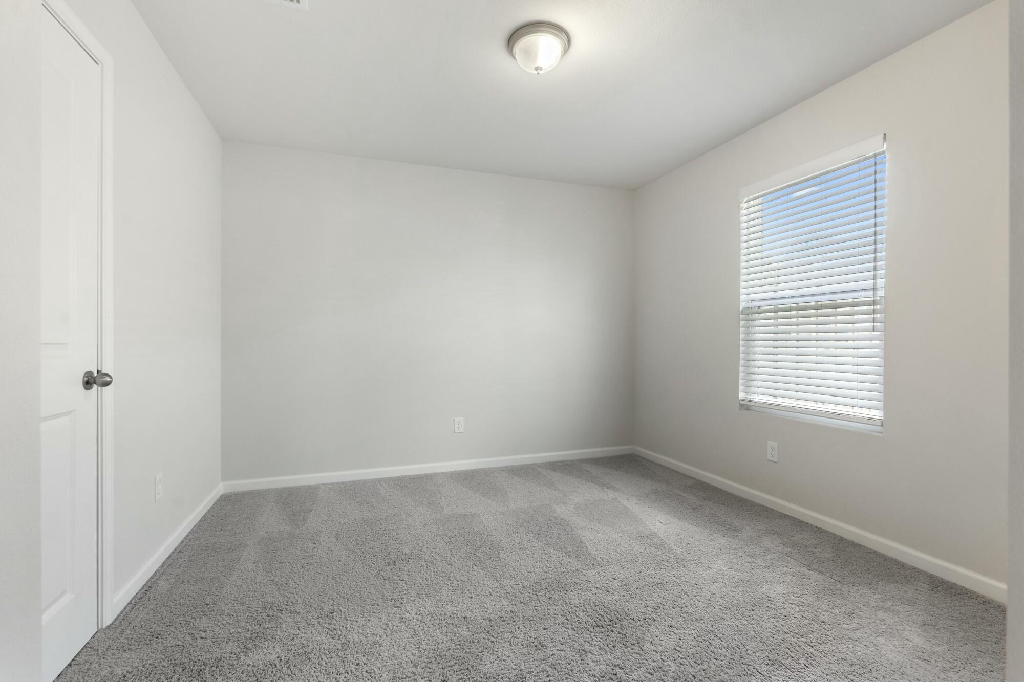 610 Riverwalk Circle Freeport, FL 32439 - Photo 32 of 50 an empty room with a window