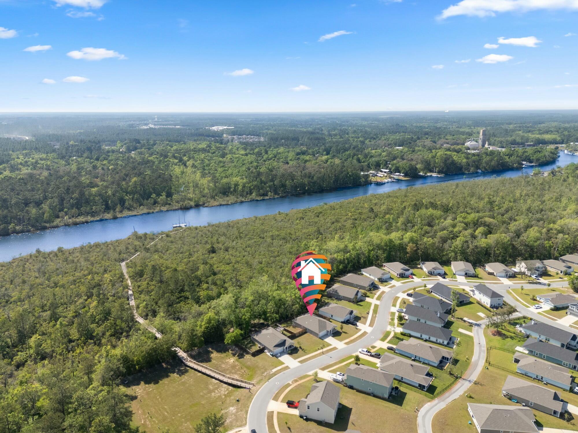610 Riverwalk Circle Freeport, FL 32439 - Photo 44 of 50 a view of a lake with a yard
