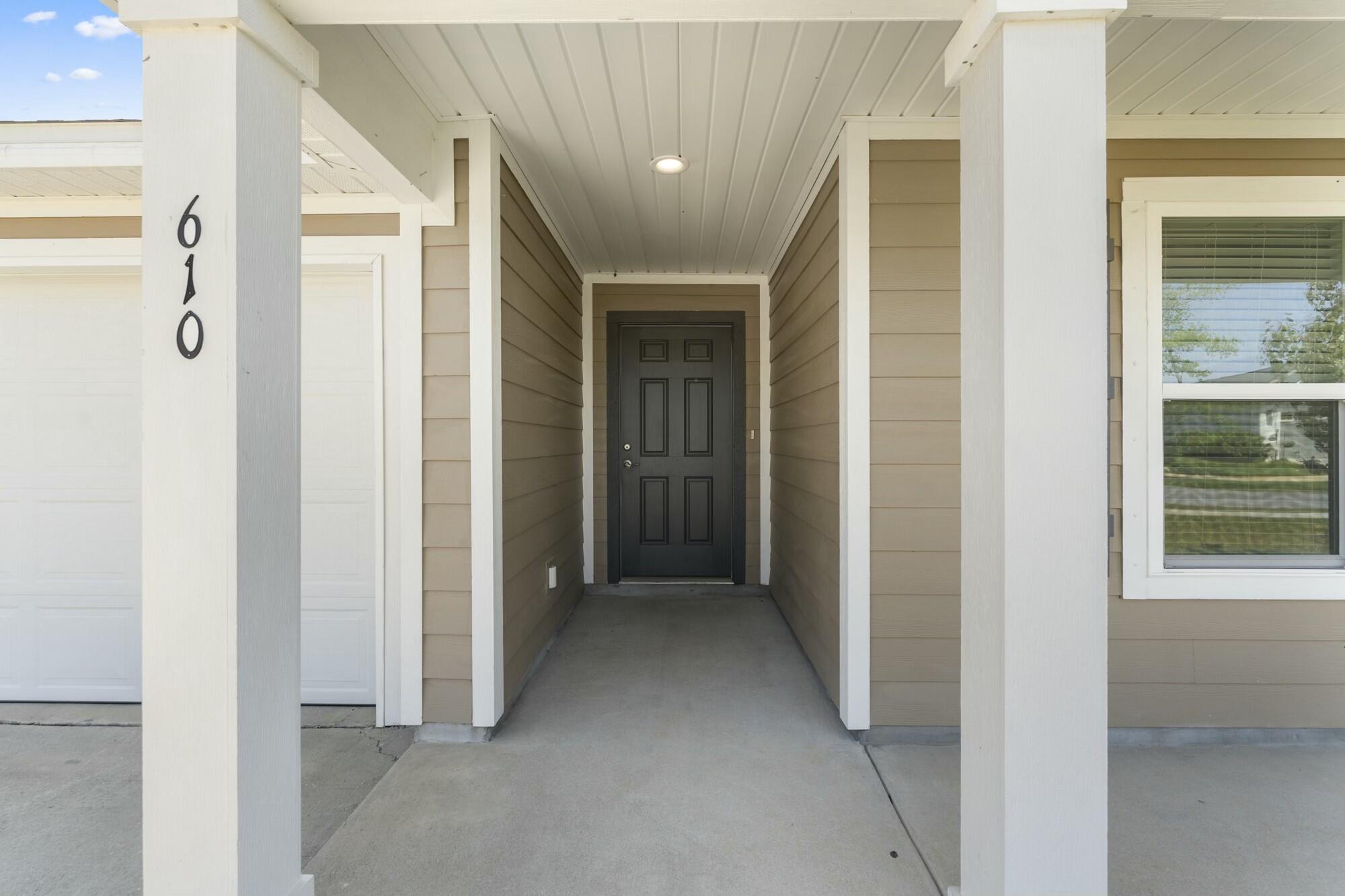 610 Riverwalk Circle Freeport, FL 32439 - Photo 5 of 50 a view of a hallway with wooden shelves