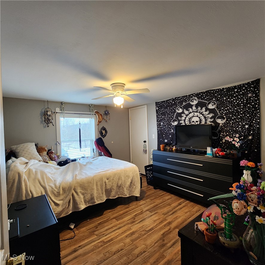 6487 Klass Road Cambridge, OH 43725 - Photo 13 of 20 Bedroom with dark wood finished floors and ceiling fan