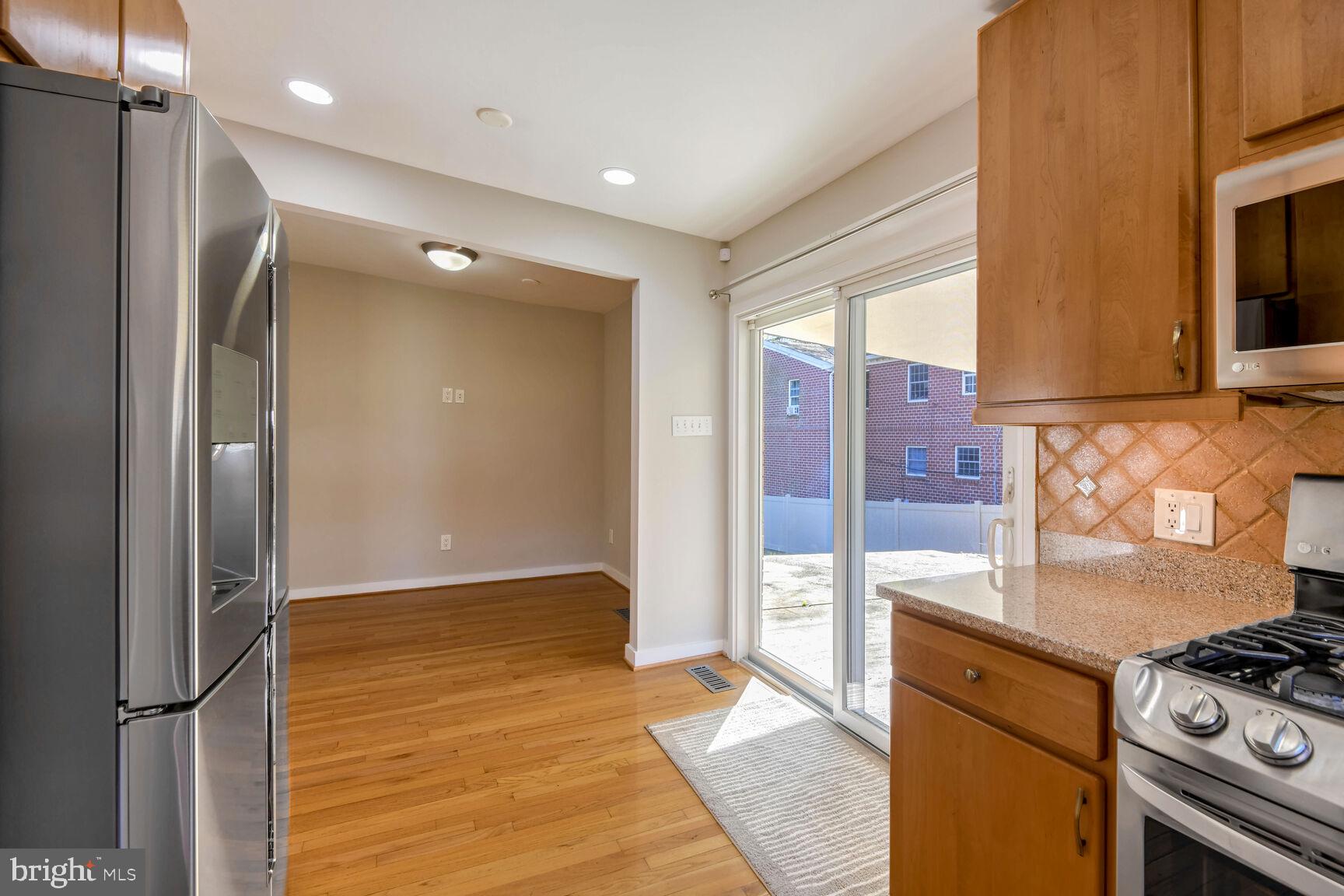 14645 Good Hope Road Silver Spring, MD 20905 - Photo 11 of 26 Bright kitchen with outdoor access.