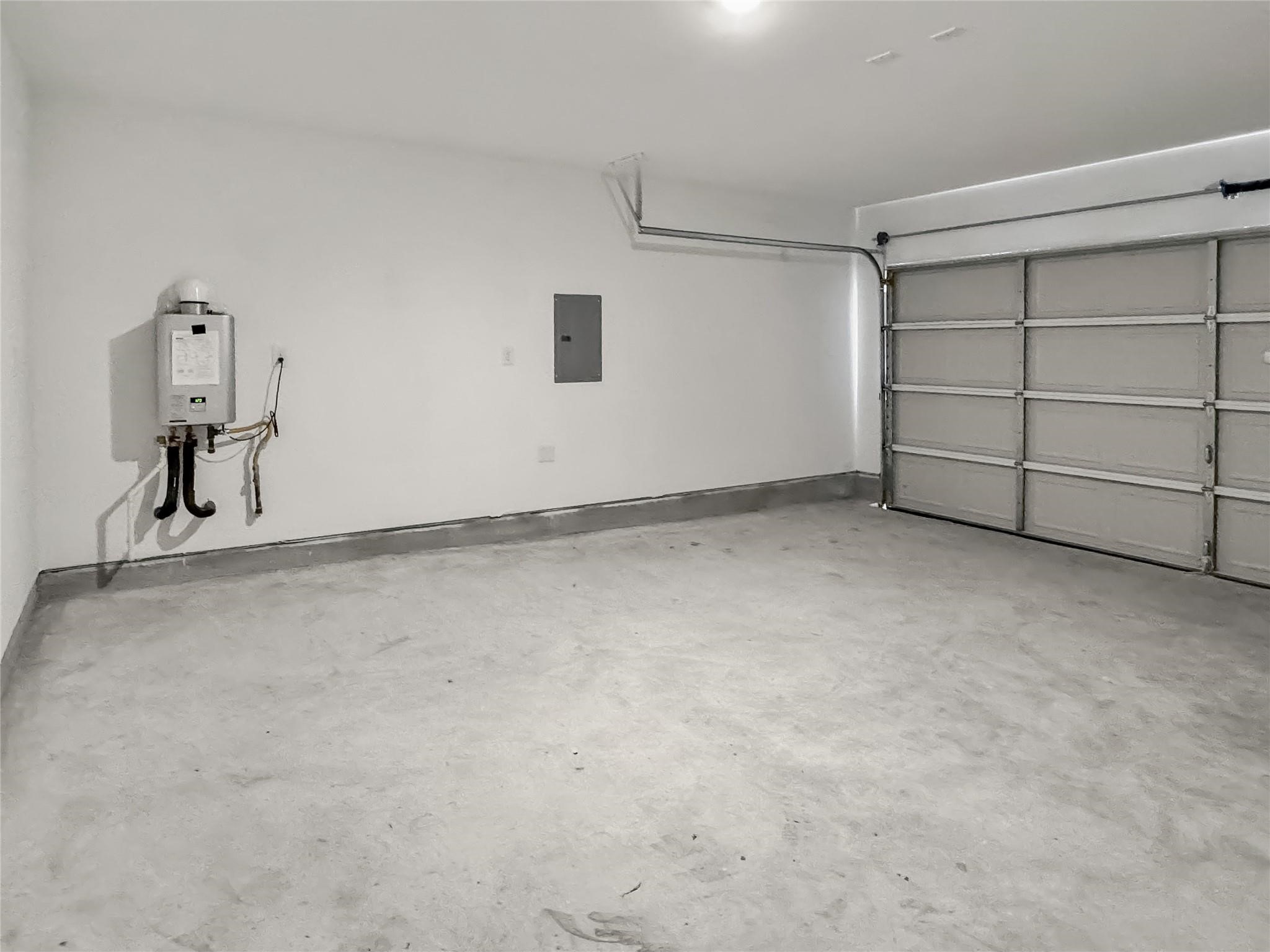 12430 Wild Strawberry Road Houston, TX 77038 - Photo 28 of 34 Two-car garage equipped with an automatic garage door opener for added convenience.