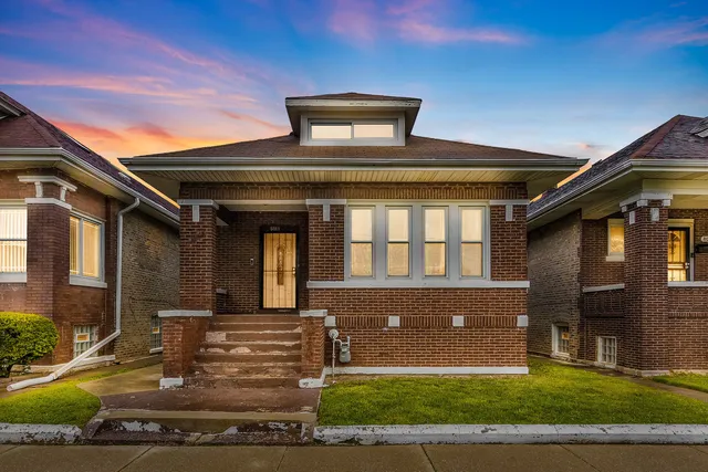 a front view of a house with yard
