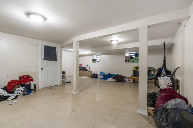 a view of a livingroom with furniture and a fan