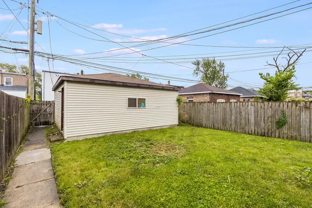 a view of a backyard with potted plants
