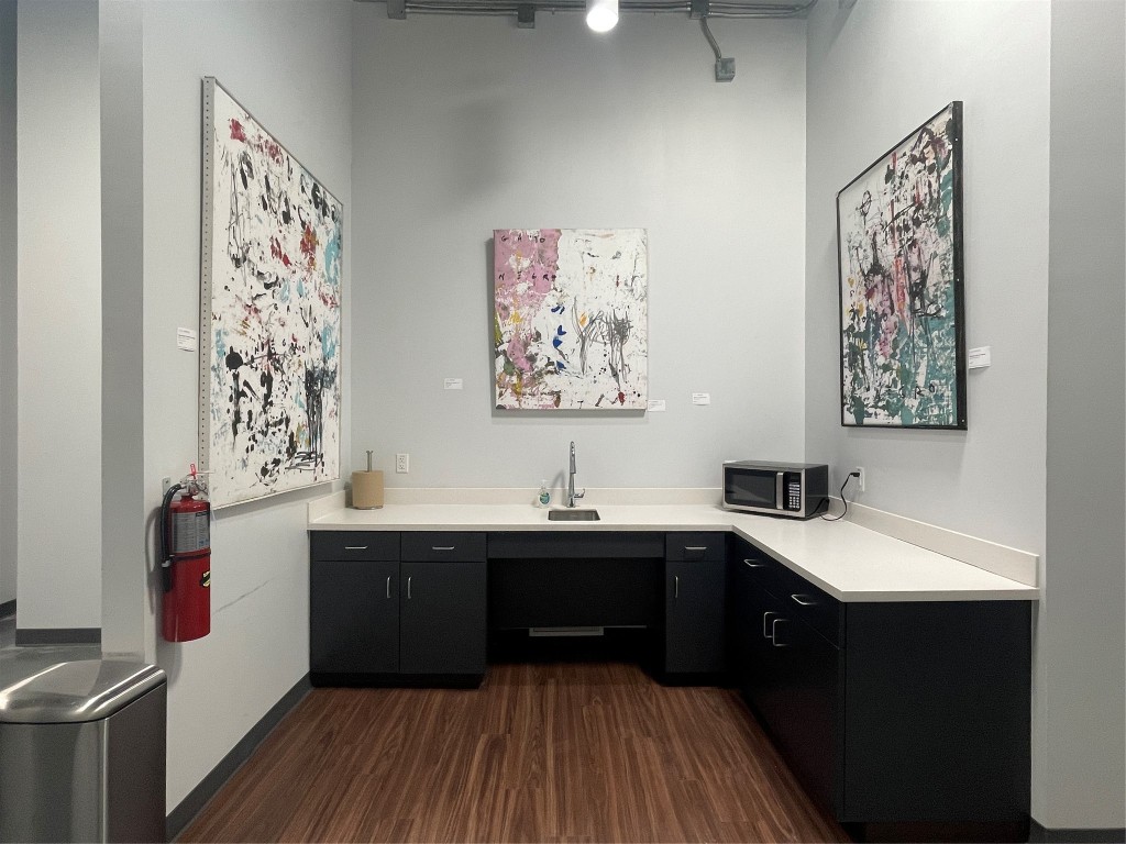 4229 North FM 620, Unit 324 Austin, TX 78734 - Photo 13 of 27 a kitchen with a sink and a stove top oven