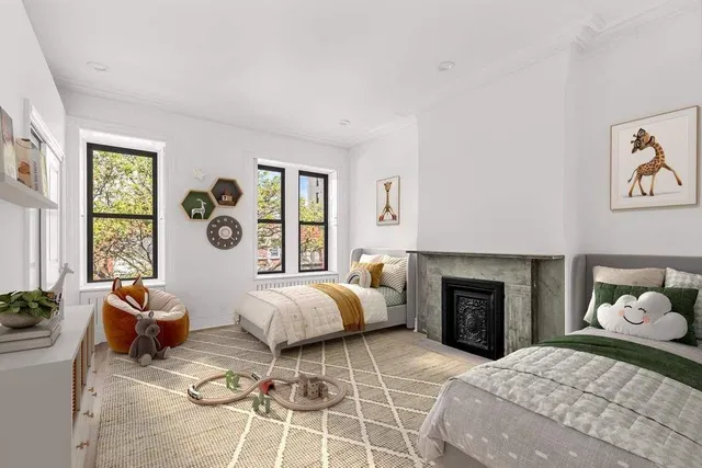 a bedroom with furniture and a window