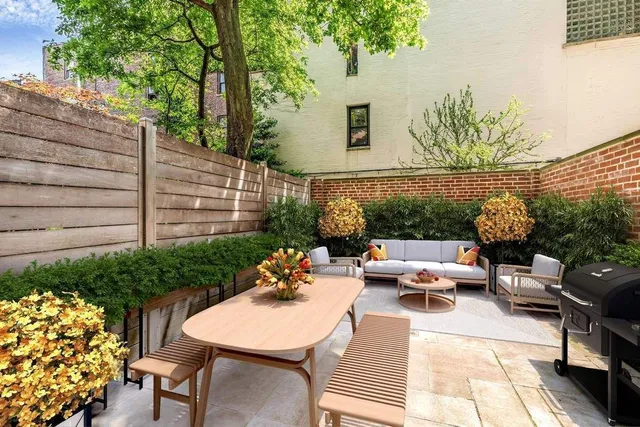 a kitchen with a sink a counter top space stainless steel appliances and cabinets
