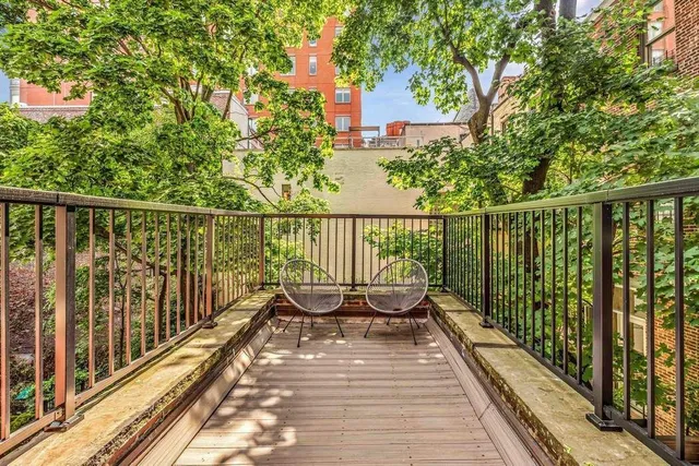 a view of a livingroom with an empty space and a fireplace