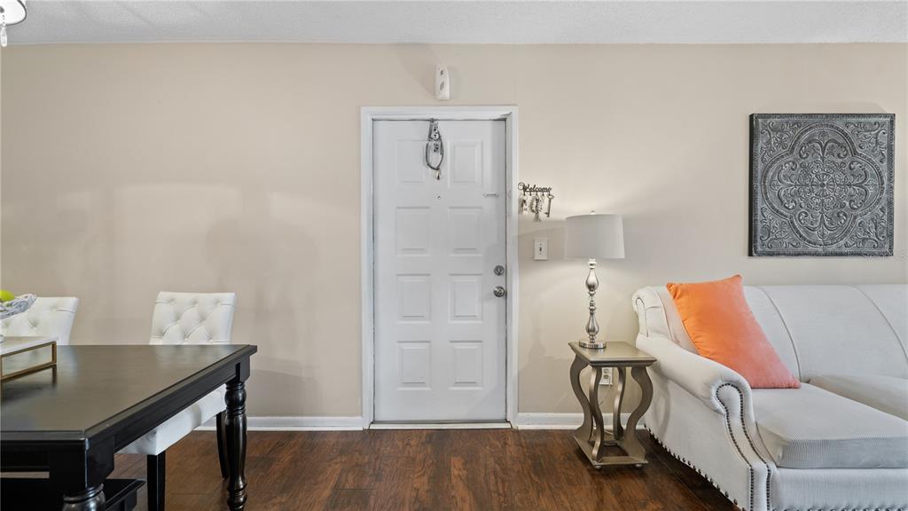 8203 Sun Spring Circle, Unit 12 Orlando, FL 32825 - Photo 14 of 38 a workspace with furniture and wooden floor